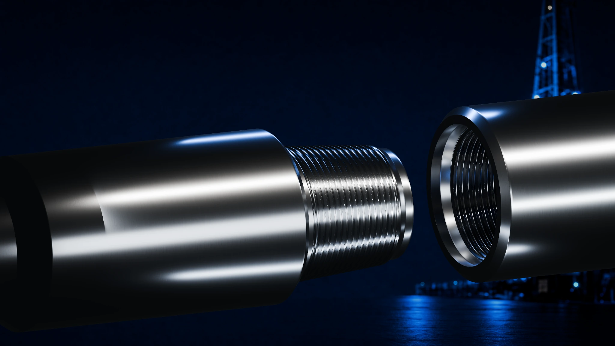 TSDS50 pin and box tool joints with machined steel finish against an industrial night background.